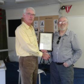 Outgoing Honorary Curator receiving certificate of Life Membership from successor Alastair Crombie