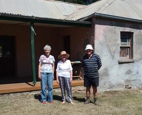 Isla Patterson with Kay & Colin Andrews in front of the original homestead