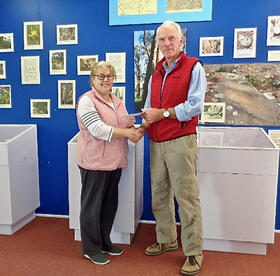 Melissa Lee presenting a cheque to Hon Curator Alastair Crombie