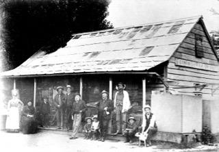 Ginninderra Store and Post Office. http://museum.hall.act.au/display/1939/person/1954/george-harcourt.html[George Harcourt] with the paper under his arm.